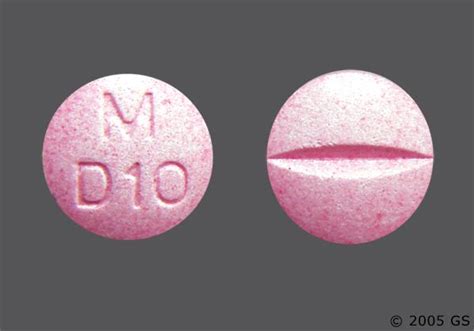 Round pink pill with m on it - 